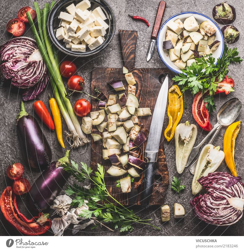 Kitchen table with vegetable ingredients, chopping board and knife Food Vegetable Herbs and spices Cooking oil Nutrition Lunch Dinner Organic produce