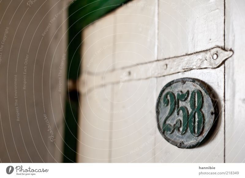 258 Door Wood Metal Old Dirty Green White Canceled Wooden door House number Dusty Forget Loneliness Old fashioned Varnished Colour photo Interior shot Deserted