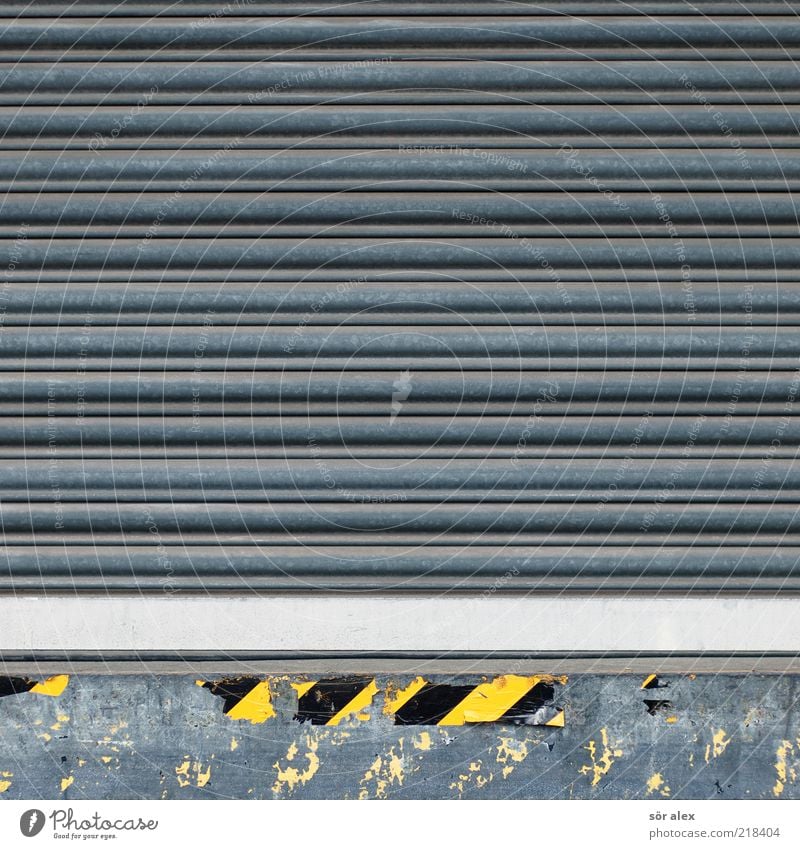 incoming goods Storage Gate Metal Yellow Black Silver Gray Tin Services Trade Logistics Loading ramp Warn Warning label Work and employment Warning sign Facade