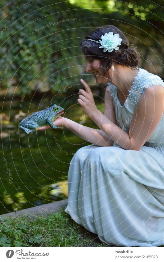 ... kiss a frog ?          - young brunette woman in evening dress looks at a frog she holds in her hand Feminine Young woman Princess Stage play Frog Prince