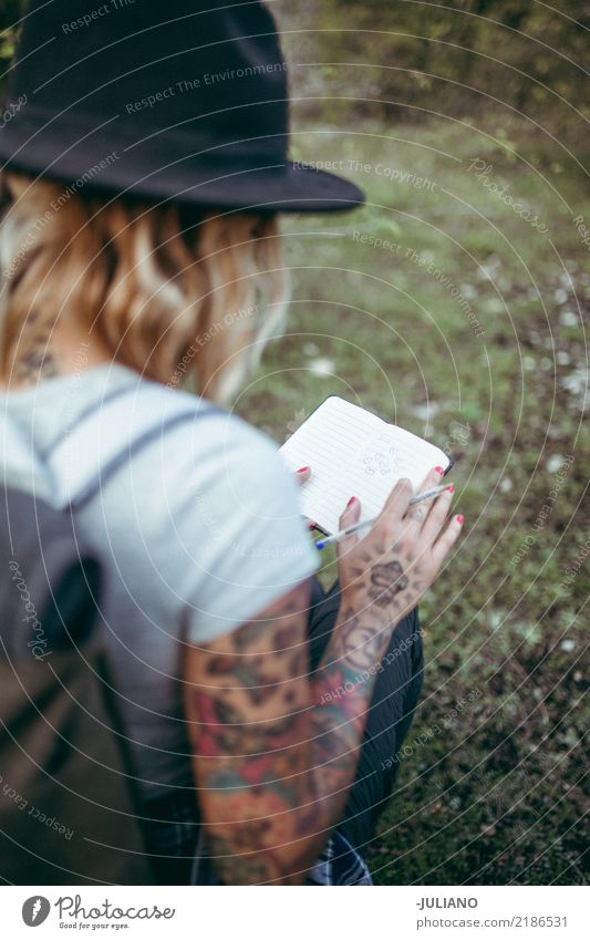 Modern hipster girl takes some notes Lifestyle Vacation & Travel Trip Adventure Freedom Study Work and employment Office work Human being Feminine Young woman