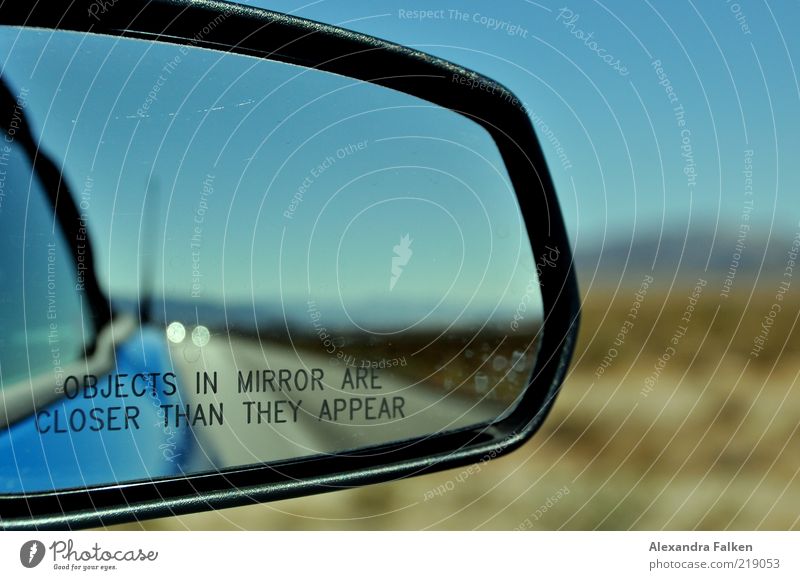 Objects in mirror... Transport Means of transport Traffic infrastructure Road traffic Motoring Street Vehicle Car Blue Rear view mirror Travel photography