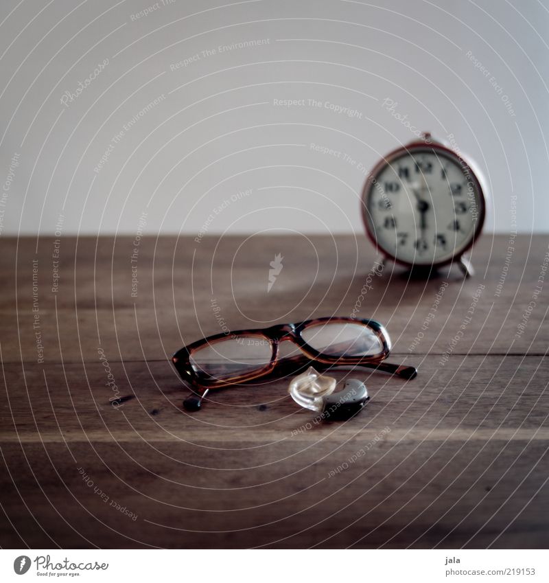 it's time... Wood Brown Gray Eyeglasses Hearing aid Alarm clock Time Senses Colour photo Interior shot Copy Space top Neutral Background Day Deserted Lie Part