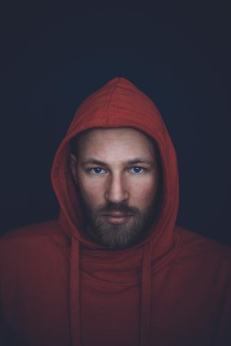 Portrait of a handsome man in mid thirties Face Human being Masculine Man Adults Fashion Beard Smiling Stand Cool (slang) Eroticism Blue Red Moody Colour people