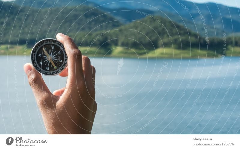 Hand with compass at mountain road at blue sky Lifestyle Vacation & Travel Tourism Trip Adventure Ocean Mountain Human being Nature Coast Lanes & trails way