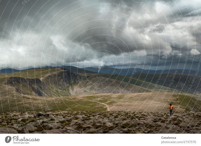 Cloud canopy, mountain landscape with hiker Masculine 1 Human being Environment Nature Earth Storm clouds Summer Bad weather Grass Hill Rock Mountain