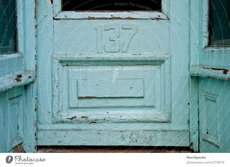 137 Building Door Wood Glass Old Blue House number Front door Frame and panel door Scratched Shabby Derelict Colour photo Subdued colour Exterior shot Deserted