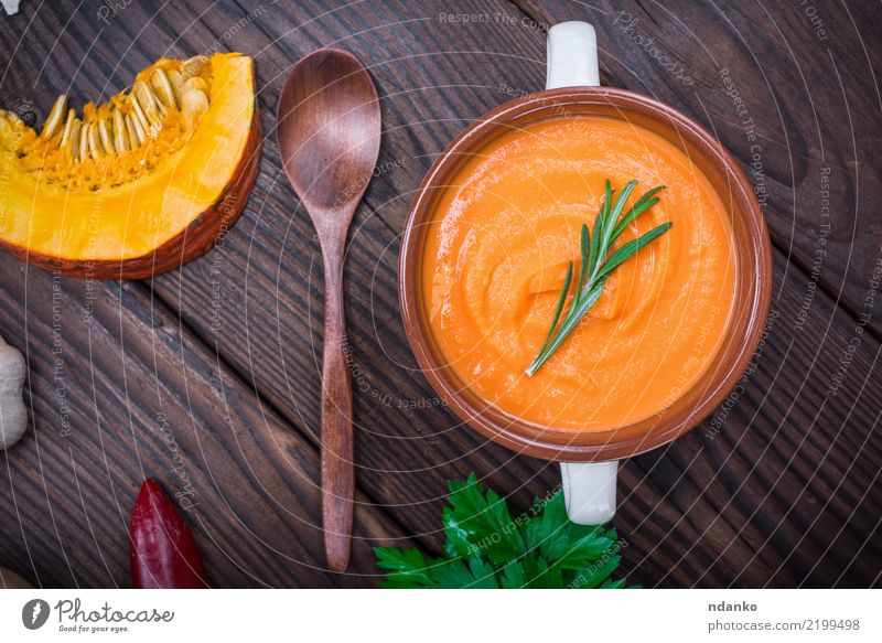 creamy pumpkin soup Vegetable Soup Stew Herbs and spices Eating Lunch Dinner Vegetarian diet Bowl Spoon Healthy Eating Table Hallowe'en Autumn Wood Diet Fresh