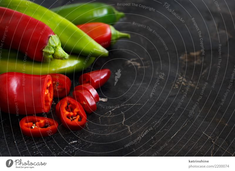 Red and green sweet peppers on dark background Vegetable Nutrition Vegetarian diet Diet Table Group Fresh Natural Green White Colour bell chilli colorful food