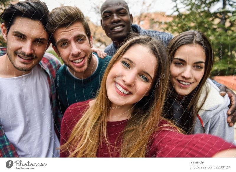 Multiracial group of friends taking selfie in a urban park Lifestyle Joy Beautiful Leisure and hobbies Vacation & Travel Camera Technology Human being Woman