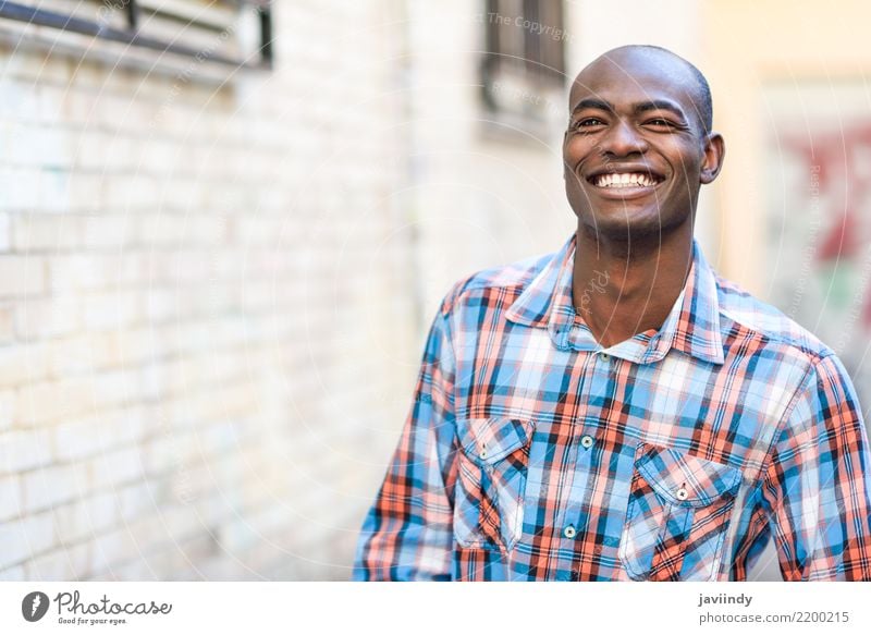 Black man very happy, smiling in urban background Happy Beautiful Human being Man Adults Street Clothing Shirt Smiling Modern Self-confident african American