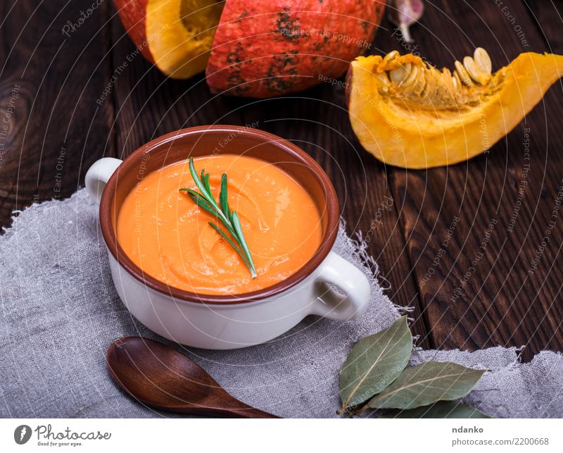 fresh pumpkin soup Vegetable Soup Stew Herbs and spices Eating Lunch Dinner Organic produce Vegetarian diet Bowl Spoon Table Hallowe'en Nature Autumn Wood Fresh