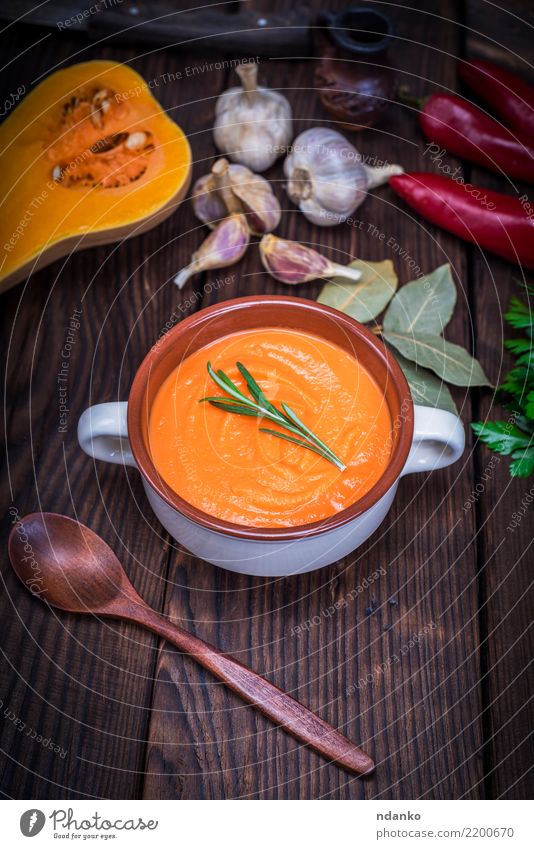 soup of pumpkin in a ceramic plate Vegetable Soup Stew Herbs and spices Eating Lunch Dinner Vegetarian diet Bowl Spoon Decoration Table Hallowe'en Nature Autumn
