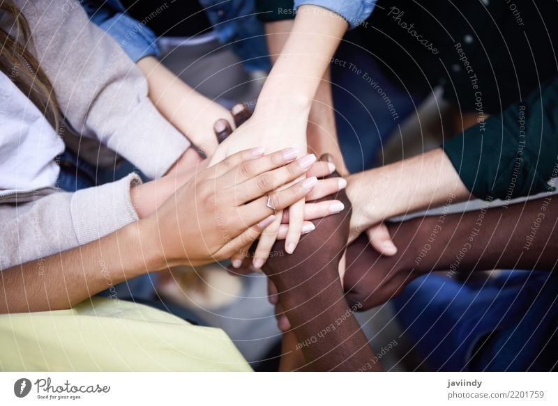 Multiracial young people putting their hands together Lifestyle Human being Woman Adults Man Friendship Hand 5 Group 18 - 30 years Youth (Young adults) Together