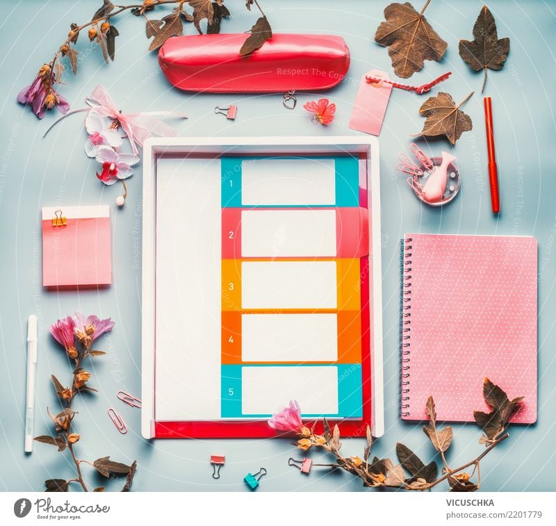 Desk with accessories and flowers Lifestyle Style Design Academic studies Office work Business Feminine Stationery Paper Piece of paper File Blue Pink White