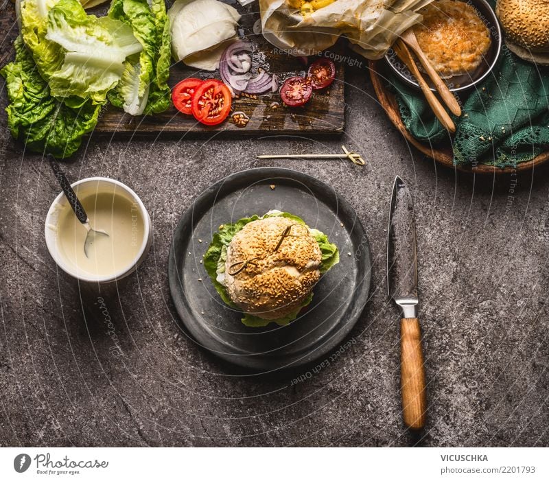 Homemade burger on the plate with knife and ingredients Food Meat Cheese Vegetable Lettuce Salad Roll Nutrition Lunch Fast food Crockery Style Design Restaurant