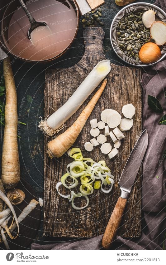 https://www.photocase.com/photos/2201813-leek-and-parsnip-on-chopping-board-food-vegetable-photocase-stock-photo-large.jpeg