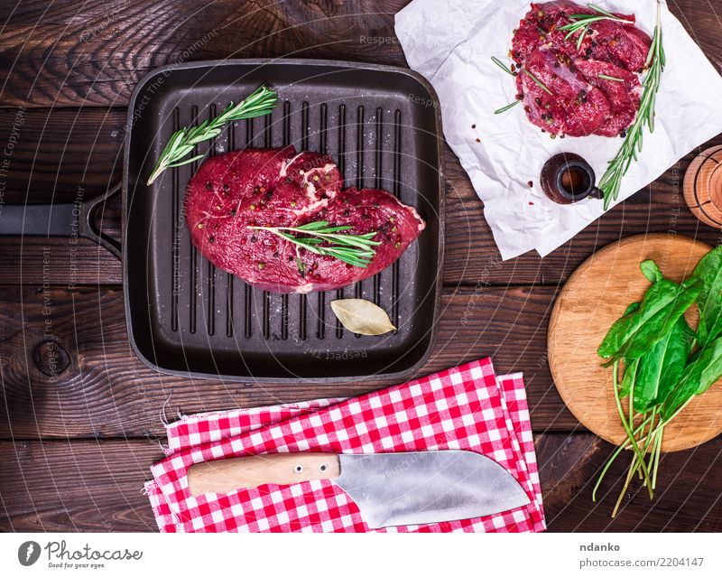 raw beef steak Food Meat Herbs and spices Dinner Pan Knives Table Kitchen Paper Wood Fresh Green Red background Beef Blood board butcher Chop close cooking Cut