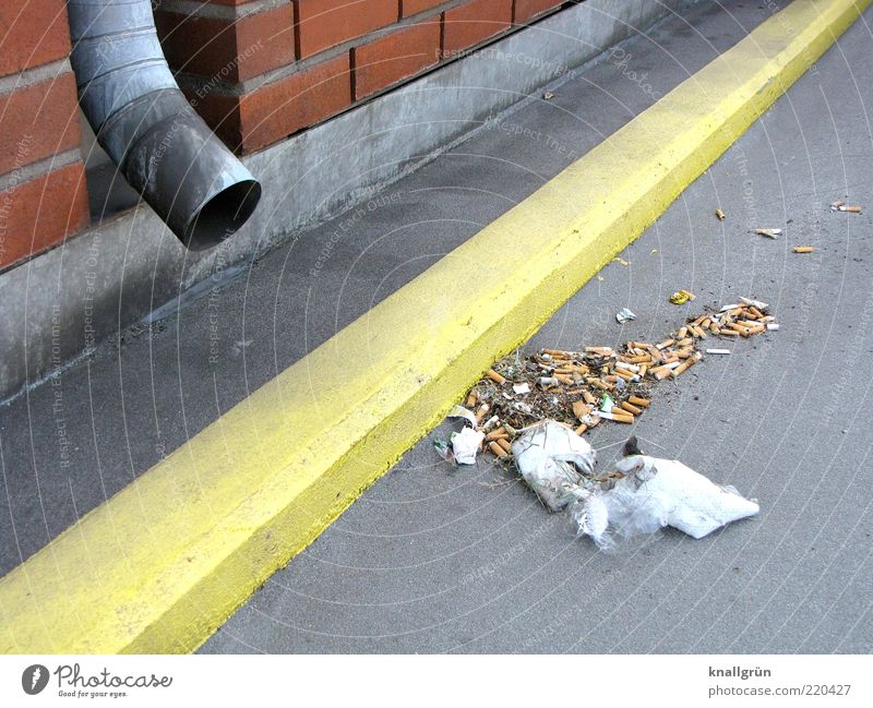 legacies Wall (barrier) Wall (building) Drainpipe Dirty Yellow Gray Environmental pollution Trash Lane markings Colour photo Exterior shot Deserted Day