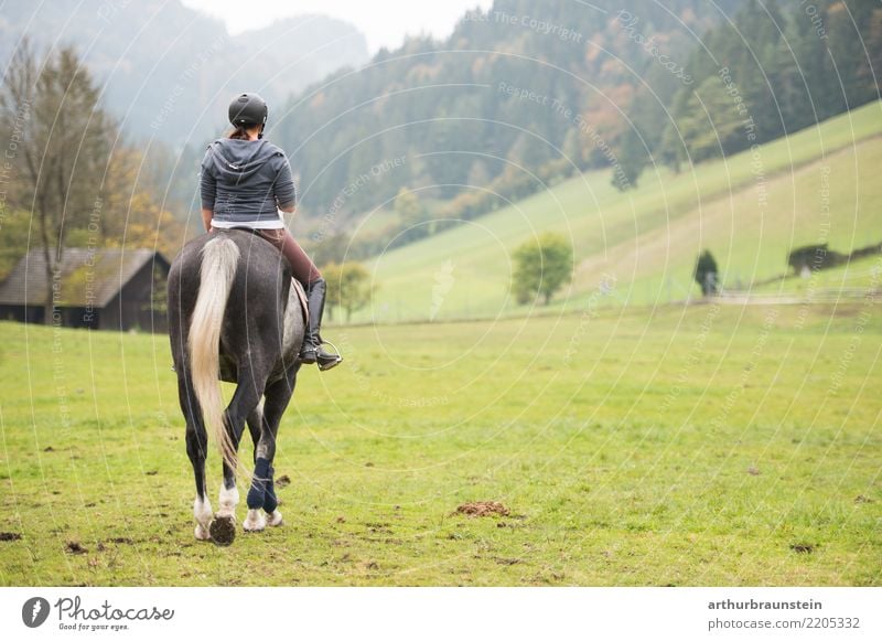 Young woman riding a horse in nature Lifestyle Athletic Leisure and hobbies Ride Vacation & Travel Tourism Trip Sports Equestrian sports Agriculture Forestry