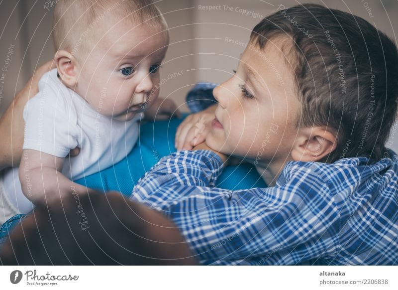 father and sons lie on the bed. Concept of happiness. Lifestyle Joy Happy Playing Bedroom Parenting Child Baby Boy (child) Man Adults Parents Mother Father