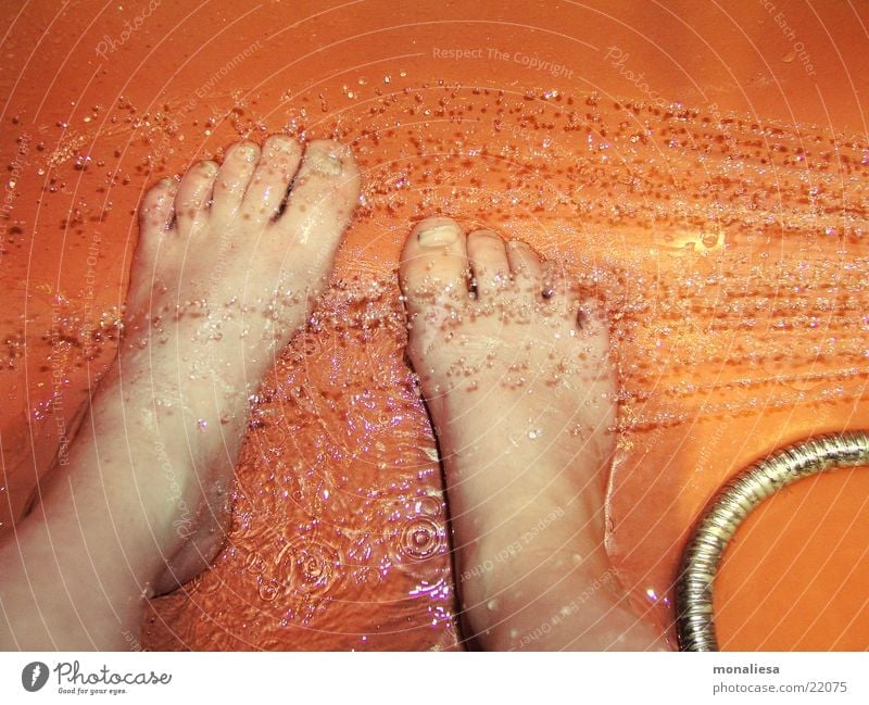 children's feet Bathtub Shower tub Jet of water Drops of water Child Clean Human being shower head Orange Feet Dirty Wash Take a shower