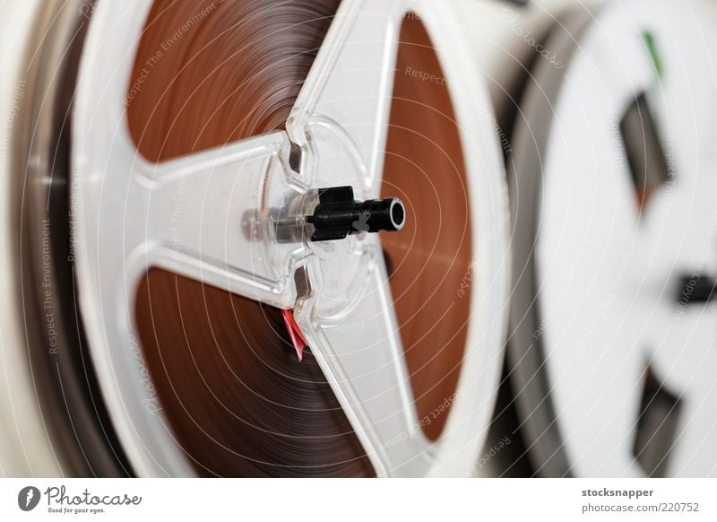 A vintage reel-to-reel tape recorder with a vu meter and a large switch  from the seventies - a Royalty Free Stock Photo from Photocase