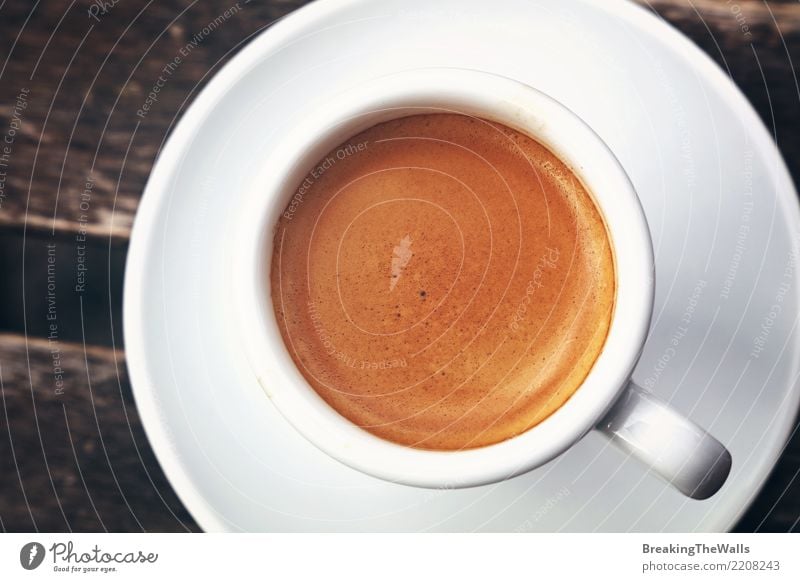 https://www.photocase.com/photos/2208243-close-up-of-espresso-cup-crema-directly-above-food-photocase-stock-photo-large.jpeg