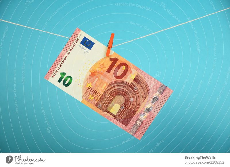 Ten Euro currency banknote hanging over blue Economy Trade Craft (trade) Financial Industry Stock market Business To fall Hang Blue Threat Center point Money