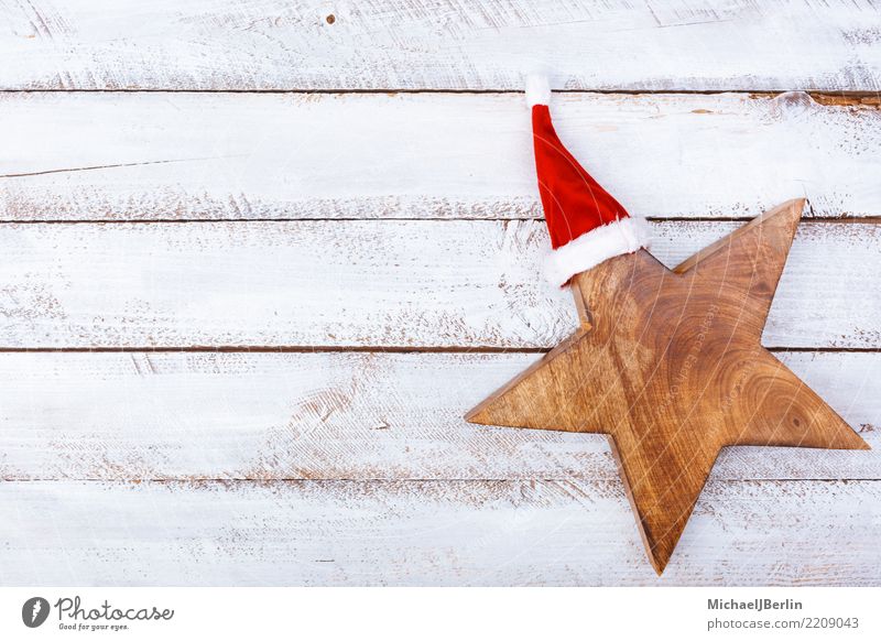 Star with Christmas cap on white wooden table Winter Christmas & Advent Wood White Anticipation Grunge Minimal Santa Claus Stars Cap Public Holiday flat lay