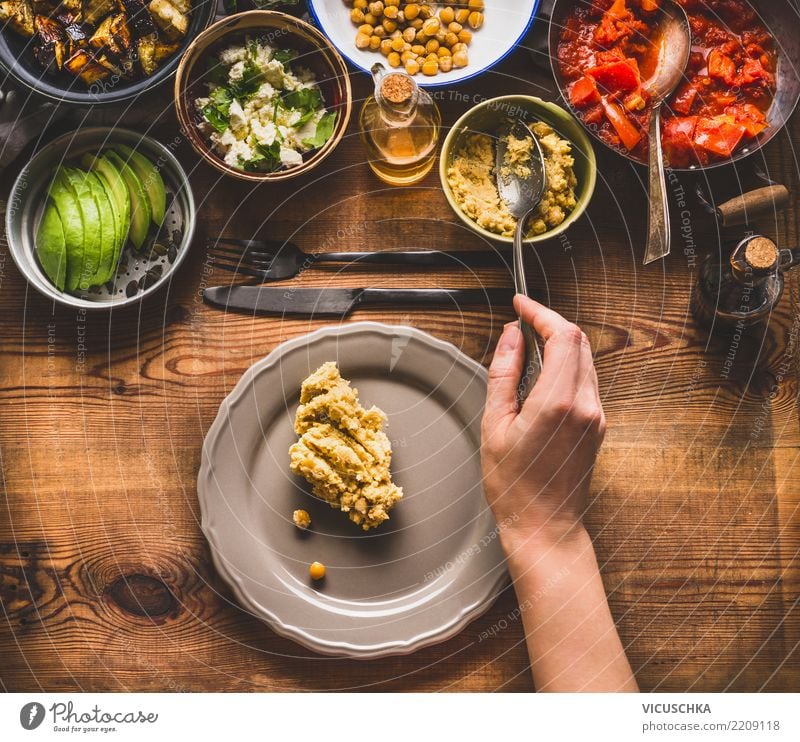 Female hand with spoon brings salad on the plate Food Vegetable Lettuce Salad Grain Herbs and spices Cooking oil Nutrition Lunch Dinner Buffet Brunch