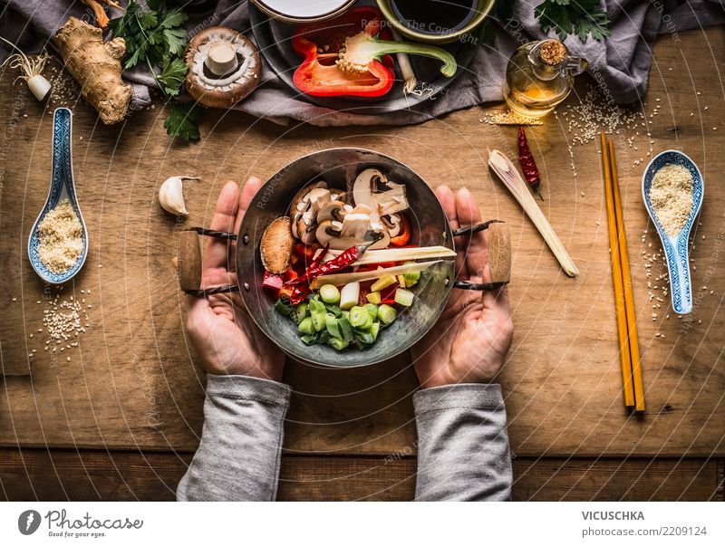 Female hands hold small wok pot with chopped vegetables Food Vegetable Herbs and spices Nutrition Lunch Dinner Banquet Organic produce Vegetarian diet Diet