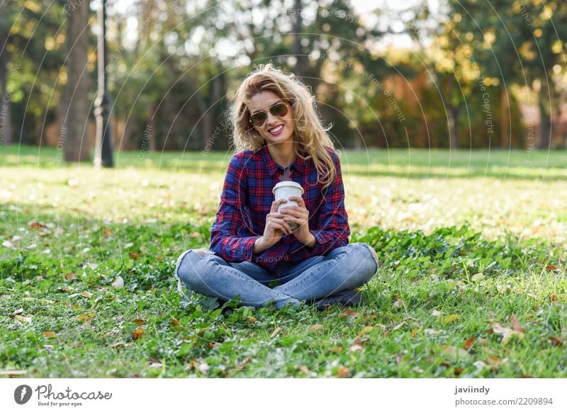 Blonde girl drinking coffee in park sitting on grass Coffee Tea Lifestyle Joy Happy Beautiful Hair and hairstyles Relaxation Human being Woman Adults Nature
