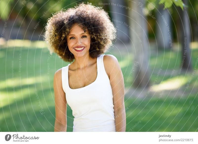 Black woman with afro hairstyle smiling in urban park. Lifestyle Style Happy Beautiful Hair and hairstyles Face Summer Human being Feminine Young woman