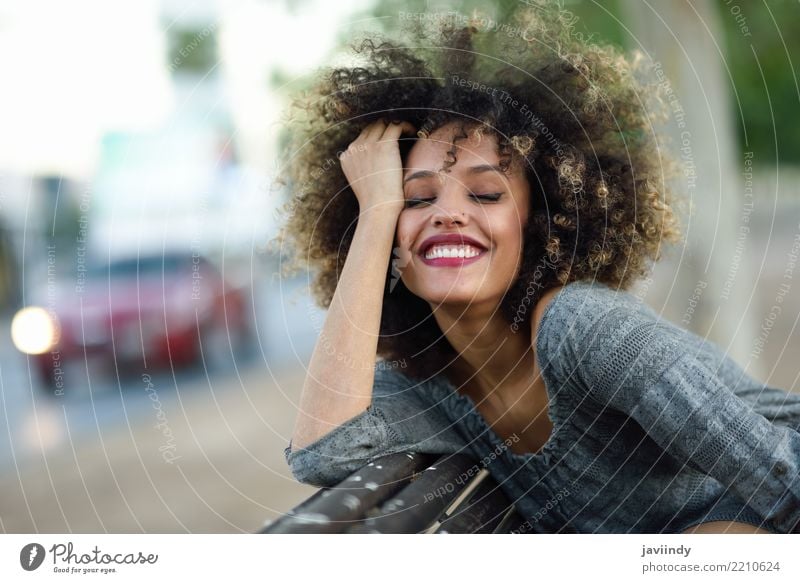 Young black woman with afro hairstyle smiling in urban background Lifestyle Style Happy Beautiful Hair and hairstyles Face Human being Woman Adults Street