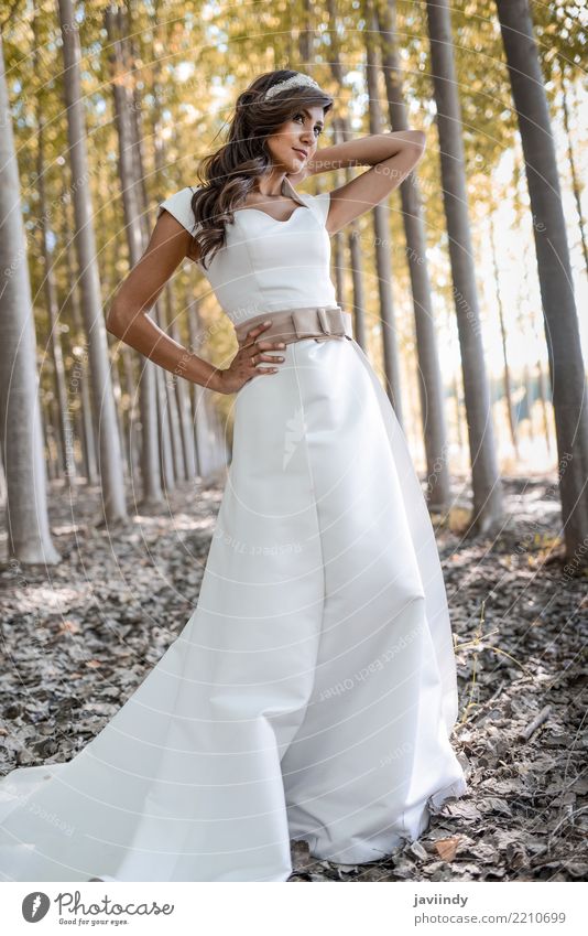 Girl in White Dress with Stylish Hair. Bride Girl at Wedding