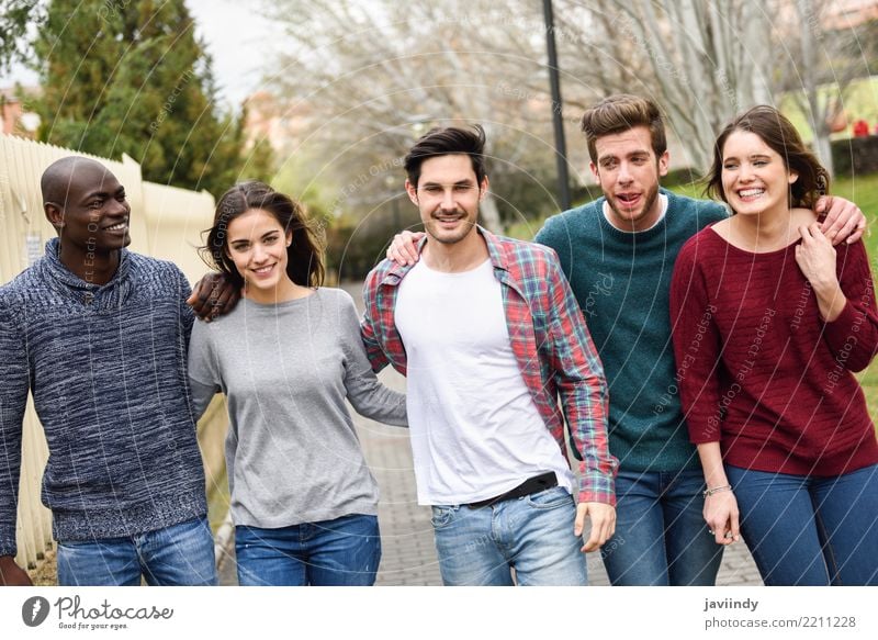 Group of multi-ethnic young people walking together outdoors Lifestyle Joy Happy Academic studies Human being Woman Adults Man Friendship 5 18 - 30 years