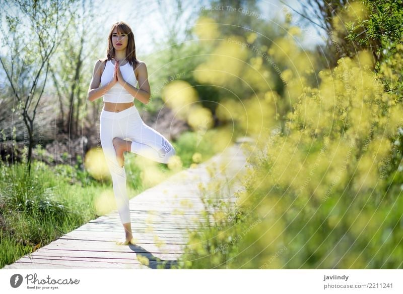 Young woman doing yoga on wooden road in nature. Lifestyle Happy Beautiful Body Relaxation Meditation Summer Sports Yoga Human being Feminine Woman Adults 1