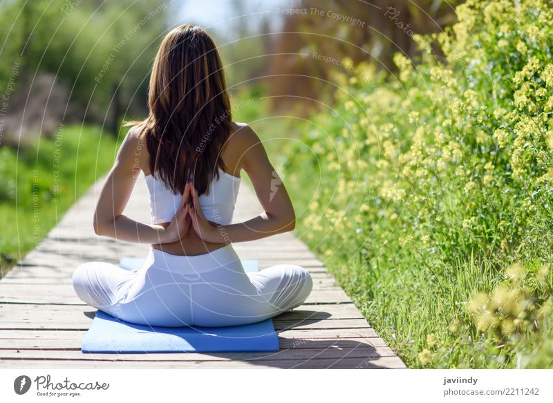 Woman doing yoga outdoors stock photo (145923) - YouWorkForThem