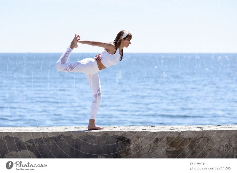 Young woman doing yoga in the beach. Lifestyle Beautiful Wellness Relaxation Meditation Summer Beach Ocean Sports Yoga Human being Feminine Youth (Young adults)