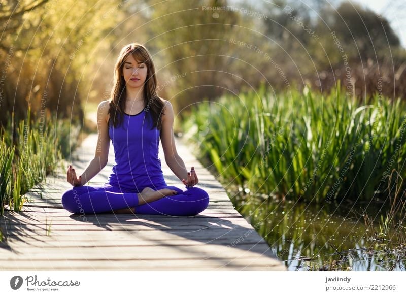 Adult woman doing yoga. Beautiful woman sitting in meditation yoga