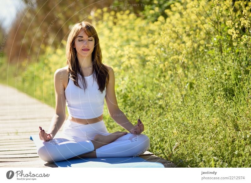 Yoga And Beauty. Full Length Of Young Beautiful Fit Woman In Sportswear  Doing Yoga While Sitting Against Industrial City View Stock Photo, Picture  and Royalty Free Image. Image 107417799.