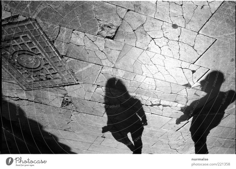 shadow play Human being Young woman Youth (Young adults) Young man Couple Partner 2 Places Old Broken Slivered Paving stone Gully Black & white photo Shadow