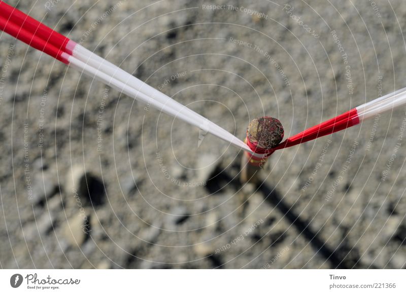 Barrier tape wrapped around pile Earth Gray Red White Construction site Iron rod Metal Wrapped around Tense Bird's-eye view Colour photo Deserted Copy Space top