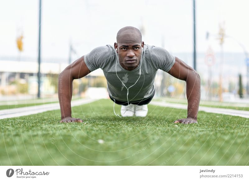 Man training fitness push ups - a Royalty Free Stock Photo from Photocase