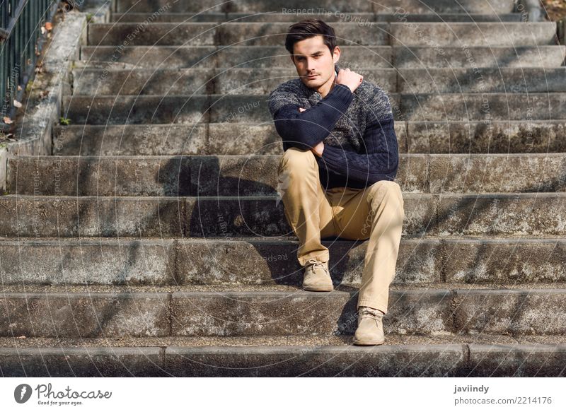 Young man with modern hairstyle sitting on stairs Lifestyle Style Hair and hairstyles Face Human being Man Adults Autumn Fashion Sweater Cool (slang) Good