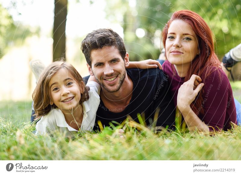 Happy young family in a urban park. Lifestyle Joy Beautiful Summer Child Human being Woman Adults Man Parents Mother Father Family & Relations Infancy 3 Group