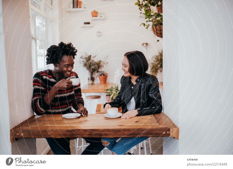 Mixed Race young adult couple drinkin coffee in cafe Breakfast To have a coffee Beverage Drinking Hot drink Coffee Espresso Lifestyle Joy Table Restaurant