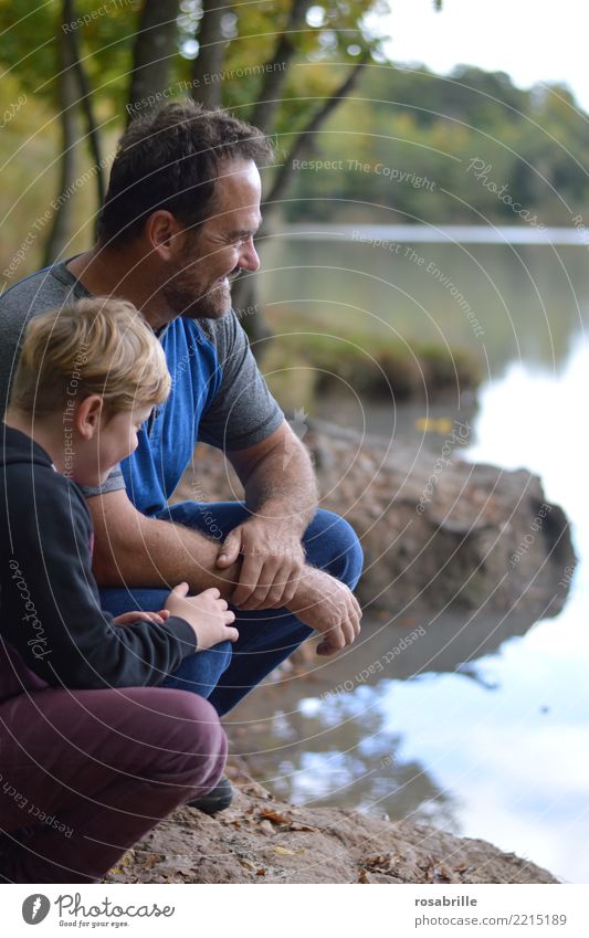 Father and son sit on a lakeside in their free time and have fun Leisure and hobbies Human being Masculine Child Boy (child) Man Adults Parents