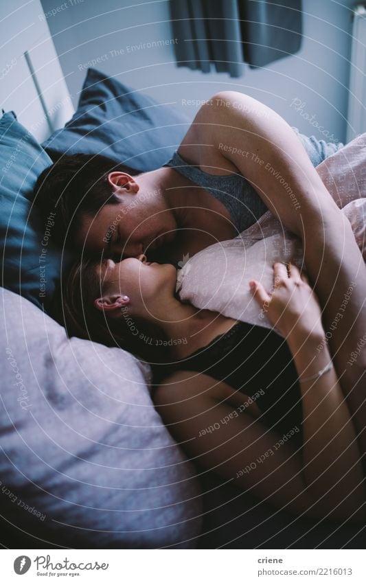 Happy Young adult couple looking at each other in bed Joy Relaxation Winter House (Residential Structure) Bedroom Woman Adults Man Couple Youth (Young adults)